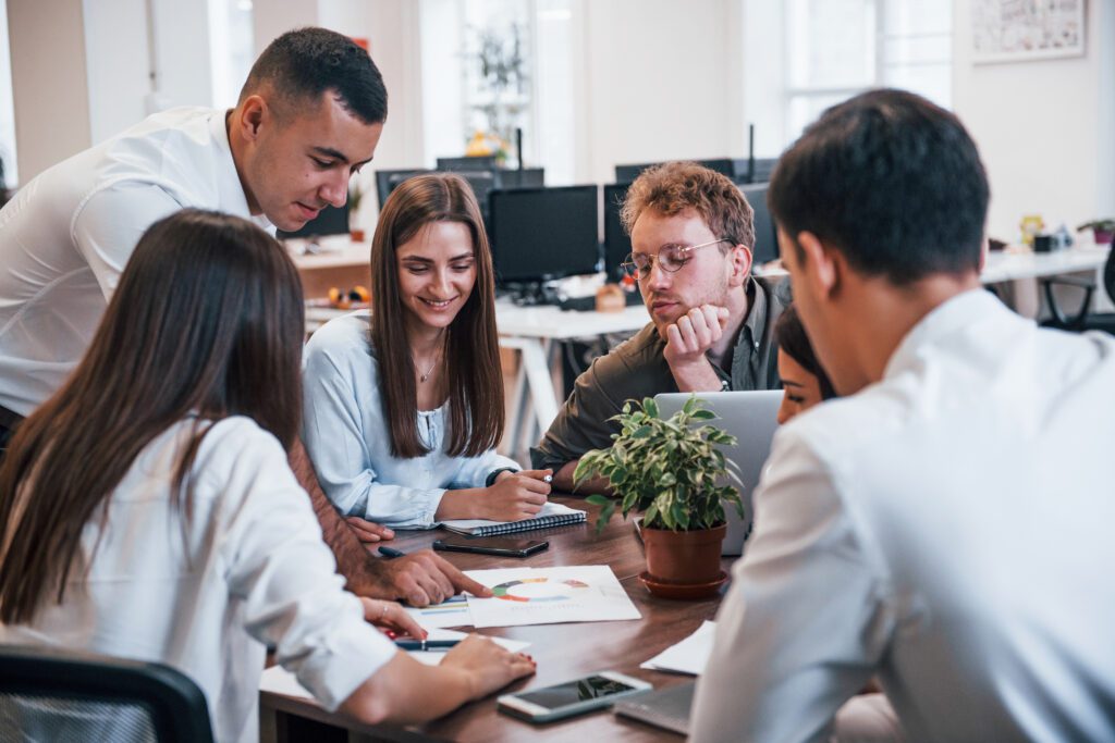 IT team sitting around the table working